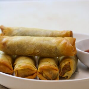 air fried spring rolls served with a dipping sauce