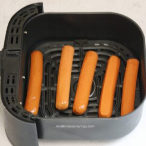 5 pieces of hotdog in an air fryer