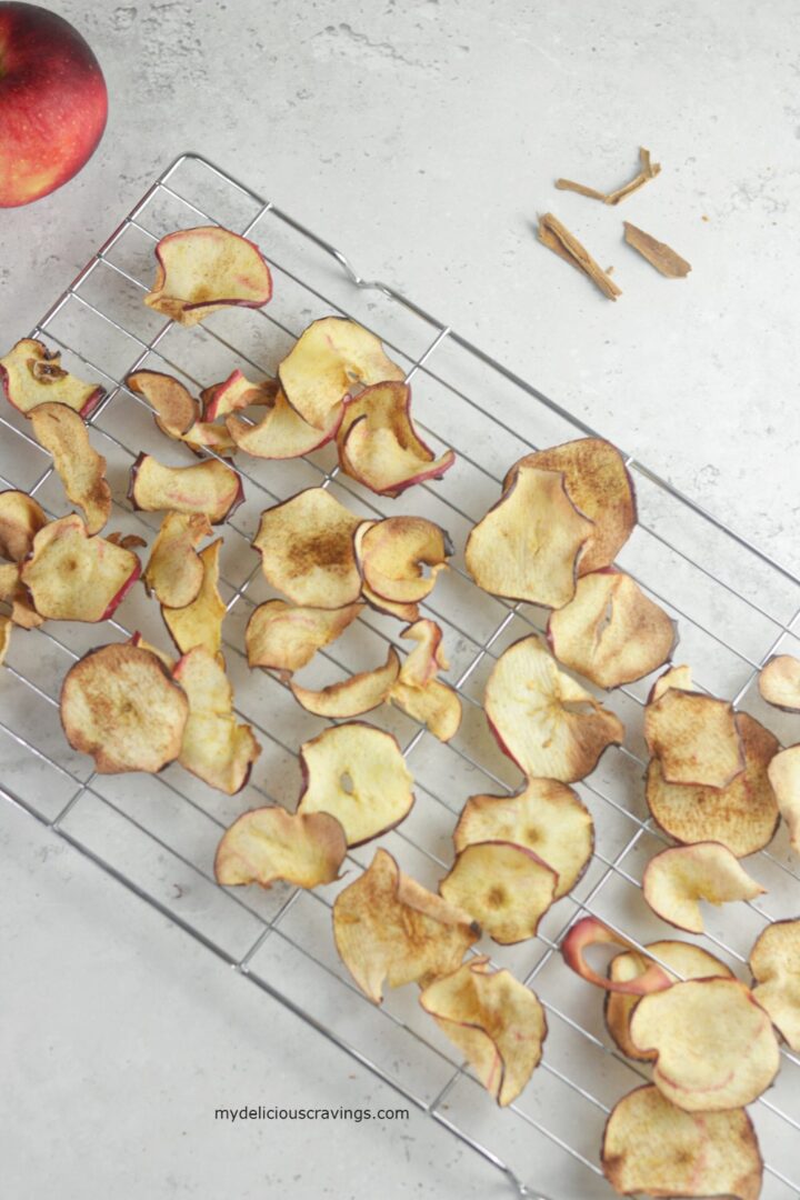 air fryer apples chips on a wire rack.