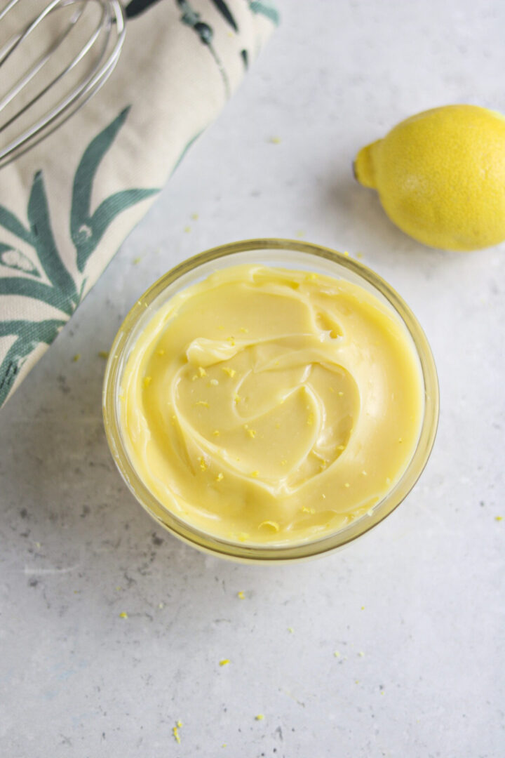 Honey butter in a bowl with sprinkled lemon zests. 