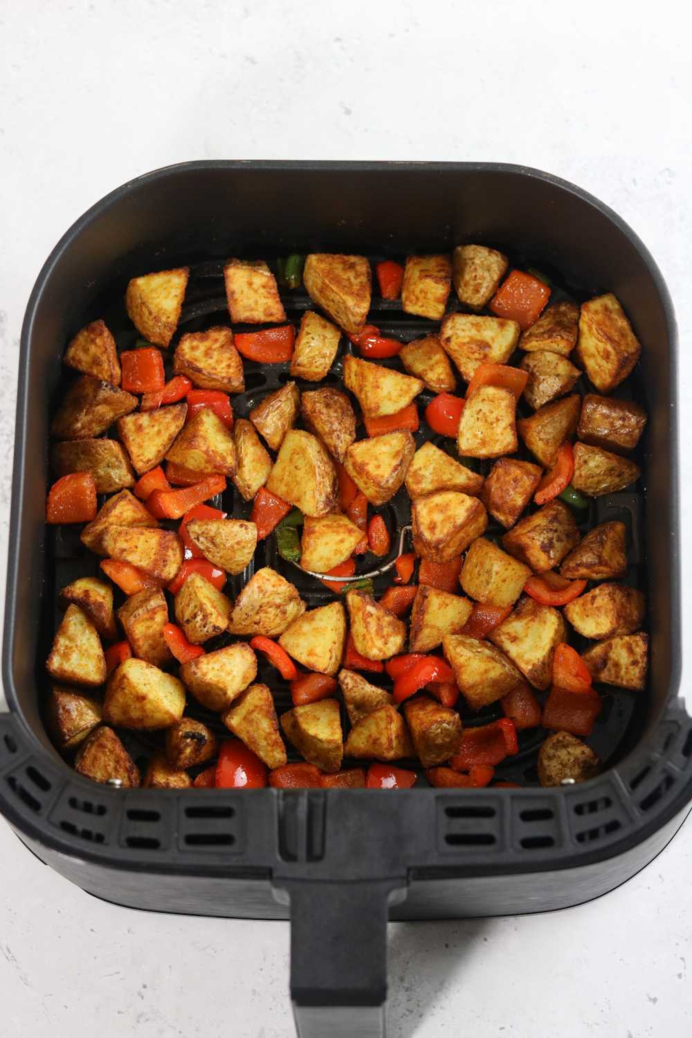 air fryer breakfast potatoes with peppers.